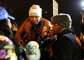 Lesley McSpadden, the mother of Michael Brown, is escorted away from in front of the Ferguson (Mo.) Police Department Nov. 24, 2014, after a grand jury's decision not to indict Ferguson Police Officer Darren Wilson in the shooting death of her son.Justin Sullivan/Getty Images